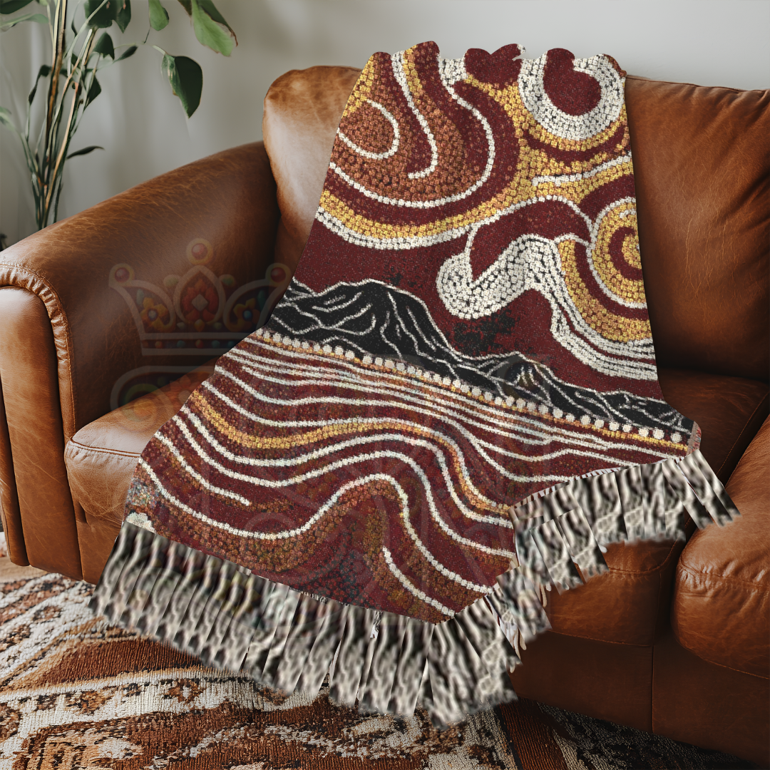 Worli tribal-inspired 100% cotton woven blanket with earthy tones and abstract patterns. Shown draped on a brown armchair sofa. Use as a throw, wall tapestry, or bed layer